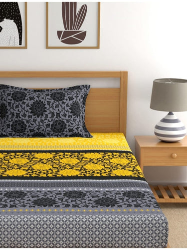 https://cdn.shopify.com/s/files/1/1857/6931/products/a118b77d-07d3-430e-81a2-faa0a532a4251694485508711DreamscapeYellowBlackEthnicMotifs140TCSingleBedsheetwith1Pil3.jpg?v=1703241843